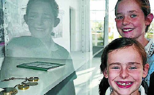 Sisters Emma and Kate Potter look at the Jackie Howe medals. Photo:Emma Channon Sisters Emma and Kate Potter look at the Jackie Howe medals. Photo:Emma Channon